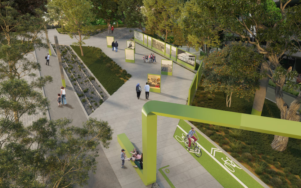 Imagem do projeto do Parque Linear da Linha Férrea, que mostra uma área de memorial com cilovia, jardins e um pórtico